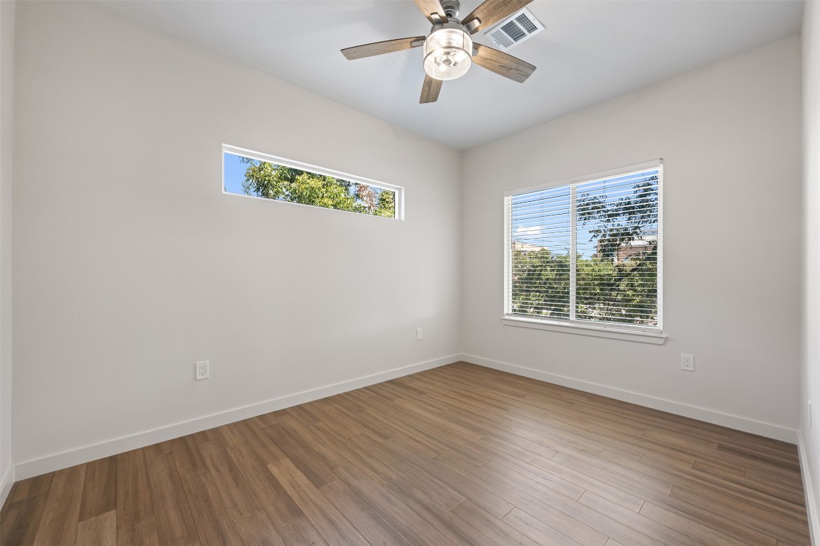 3010 Webberville Road, Unit 1 Austin, TX 78702 - Photo 30 of 40 a view of an empty room with wooden floor and a window