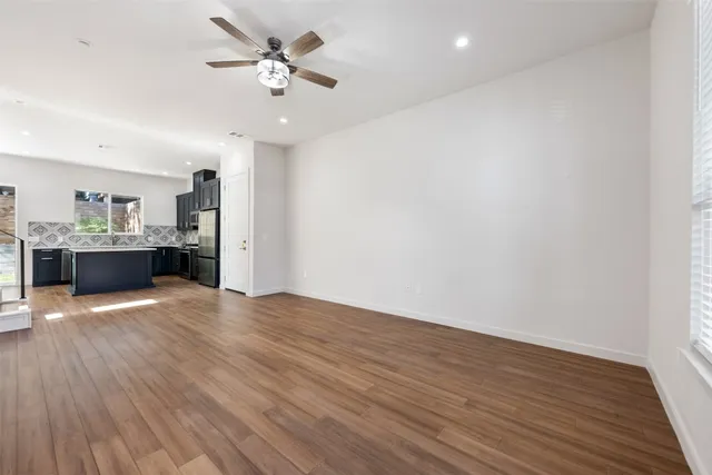 a view of a kitchen with a sink and a kitchen counter top space
