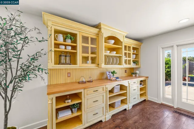 a living room with fireplace furniture and a wooden floor
