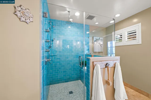 a bathroom with a bathtub and a shower