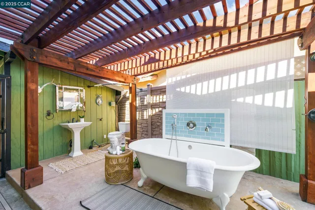 a spacious bathroom with a large tub and shower