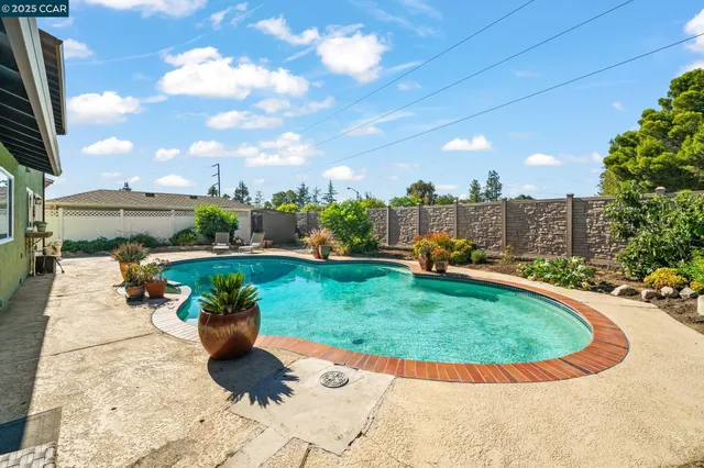 a view of a swimming pool with a patio