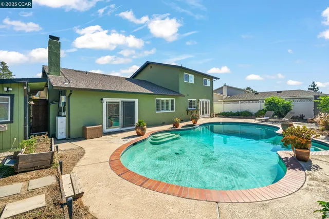 a view of a swimming pool with a patio