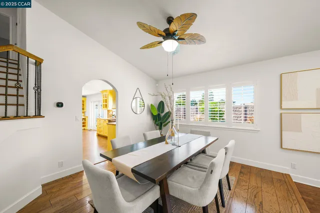 a view of a dining room with furniture and window