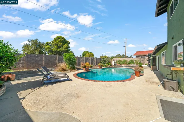 a view of a house with swimming pool
