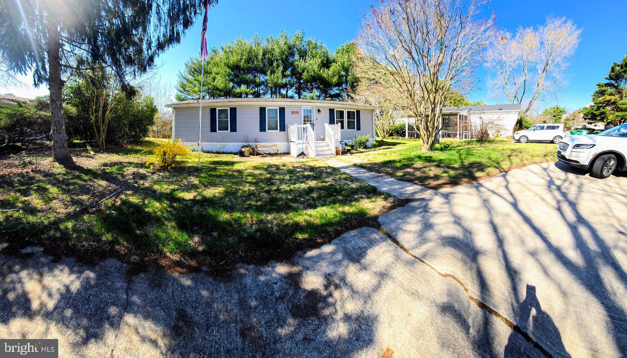 17266 Ridge Line Drive Lewes, DE 19958 - Photo 1 of 2 a view of a house with garden and sitting area