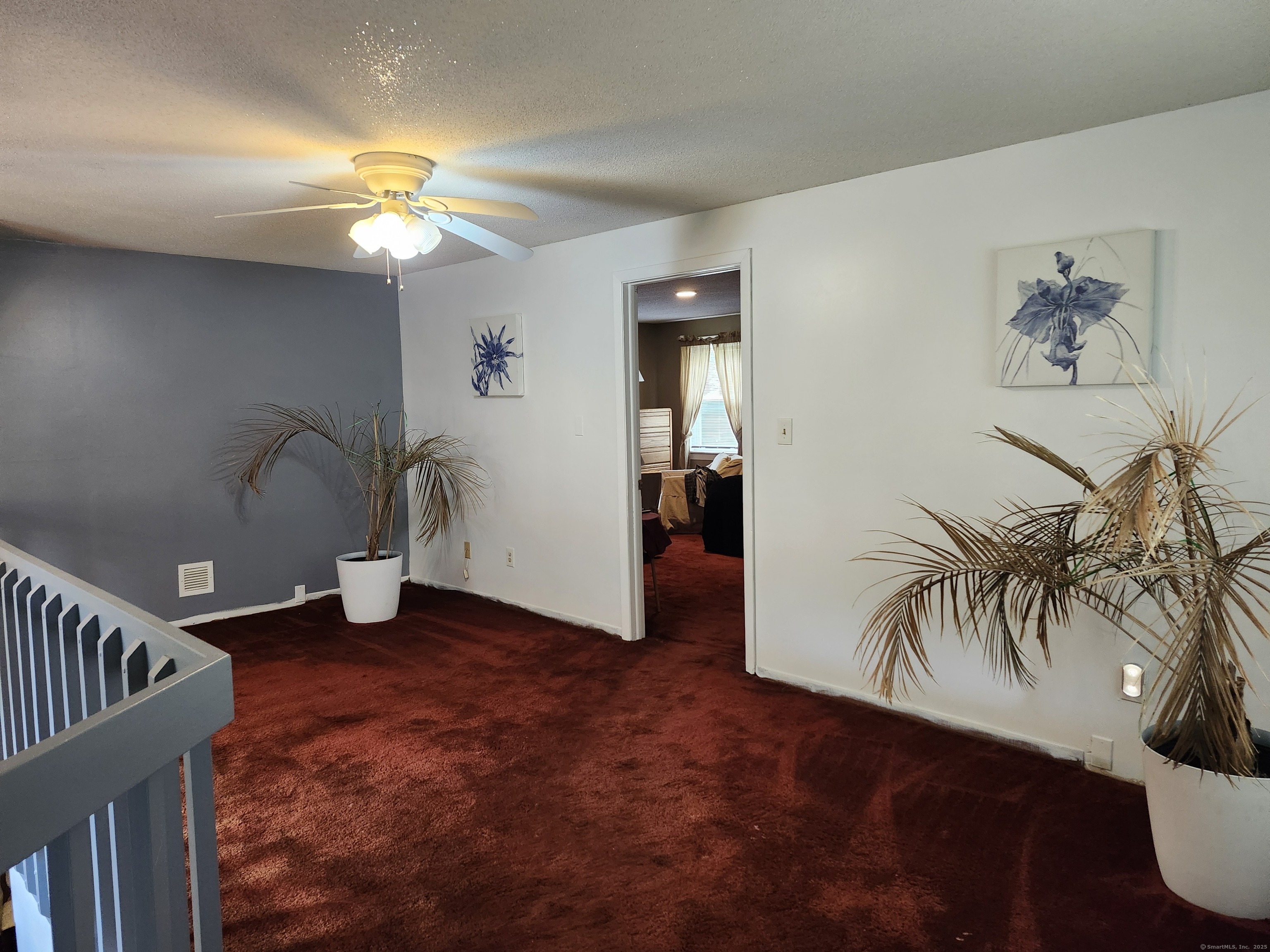39 Loren Circle Windsor, CT 06095 - Photo 11 of 16 wooden floor in a hall with a window