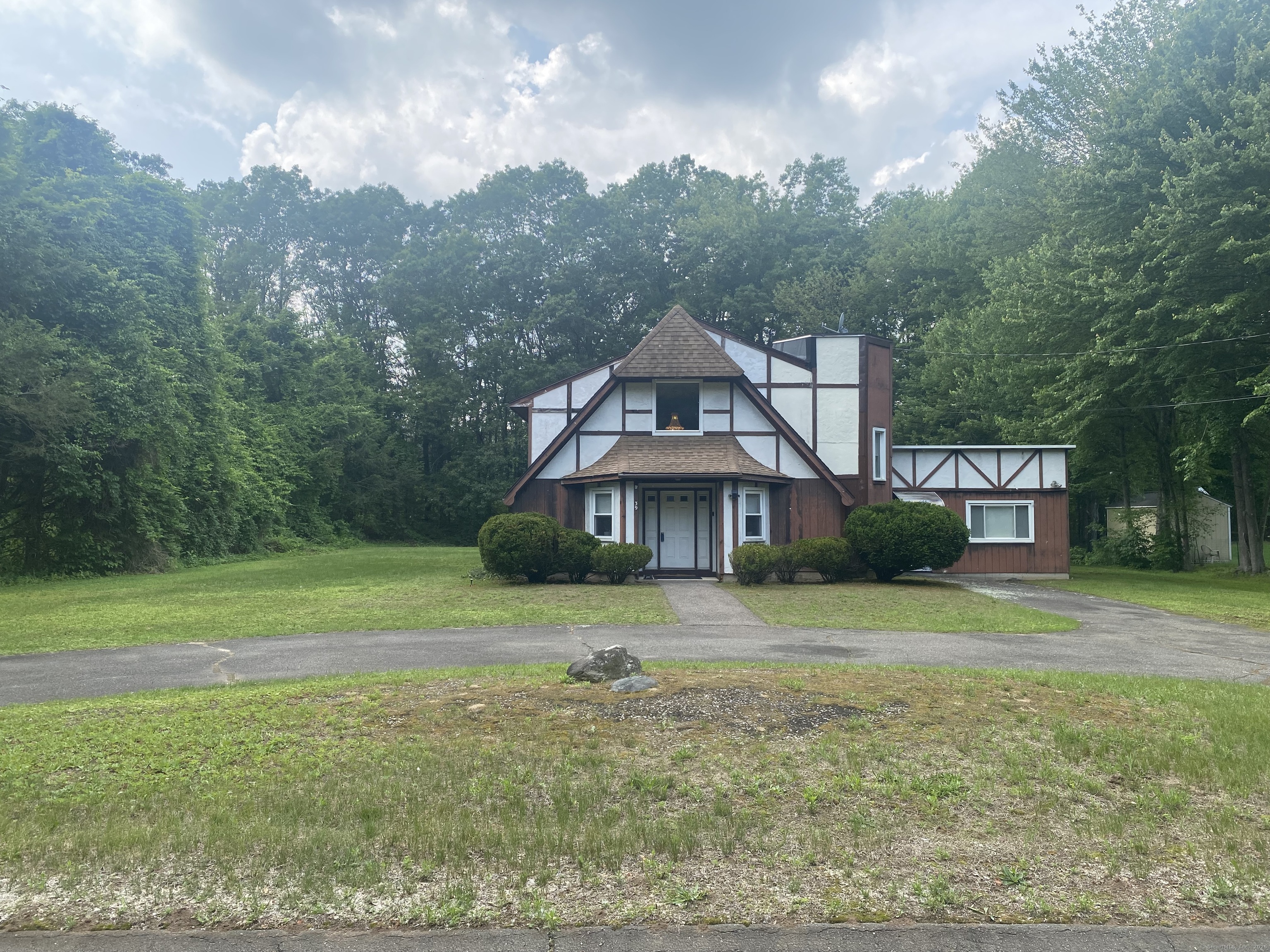 39 Loren Circle Windsor, CT 06095 - Photo 2 of 16 a front view of a house with a yard