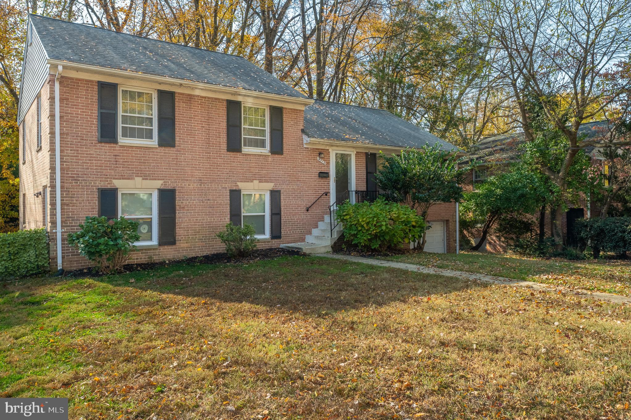 9713 Byeforde Road Kensington, MD 20895 - Photo 1 of 56 a front view of a house with garden