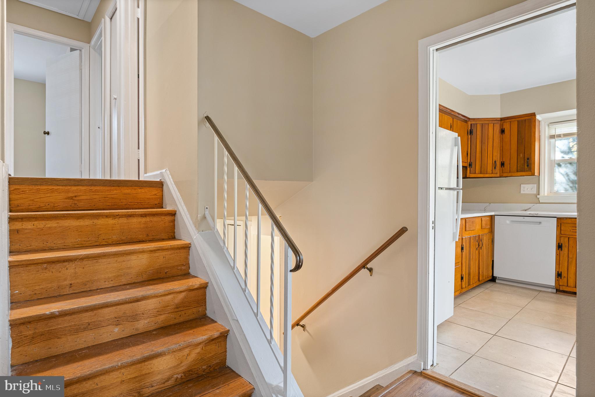 9713 Byeforde Road Kensington, MD 20895 - Photo 11 of 56 a view of entryway and hall with wooden floor