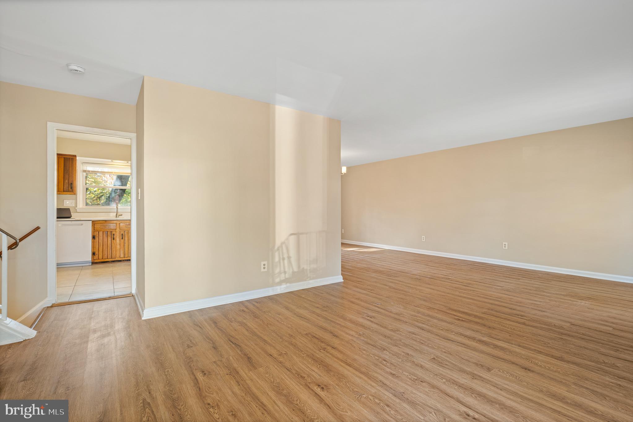 9713 Byeforde Road Kensington, MD 20895 - Photo 14 of 56 a view of a room with wooden floor and a bathroom
