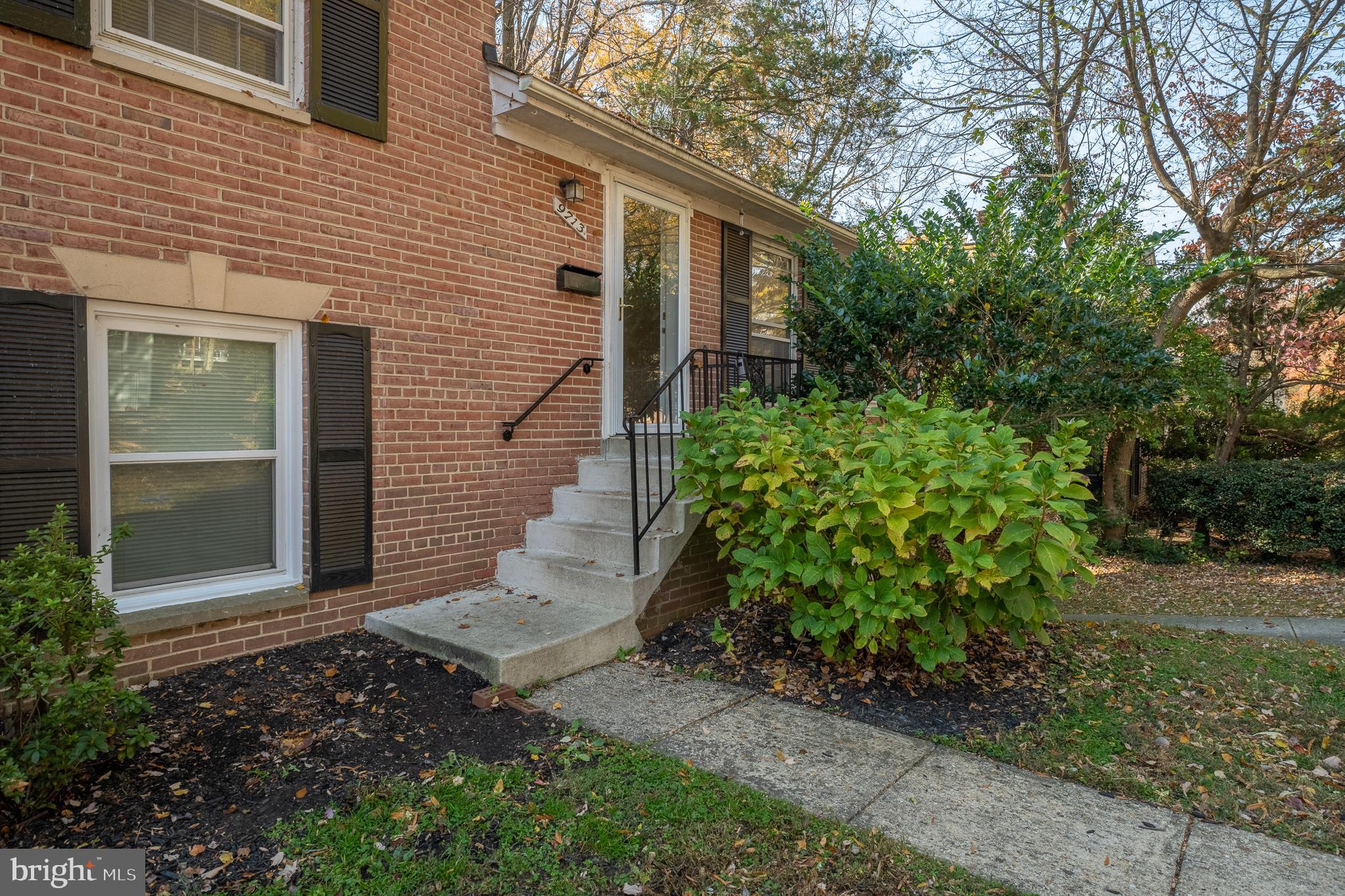 9713 Byeforde Road Kensington, MD 20895 - Photo 2 of 56 a view of a pathway of a house with potted plants