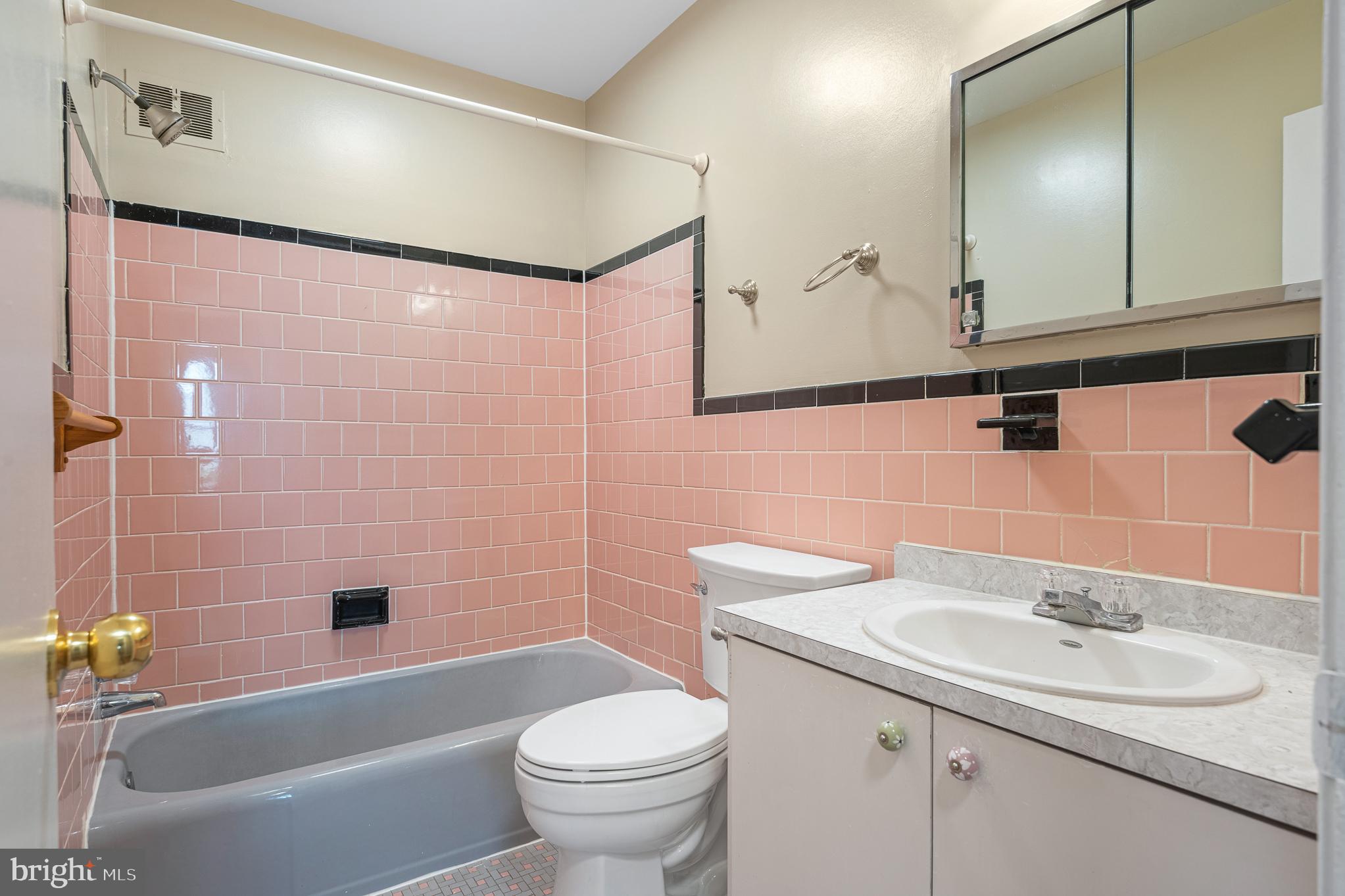 9713 Byeforde Road Kensington, MD 20895 - Photo 24 of 56 a bathroom with a sink a toilet and shower