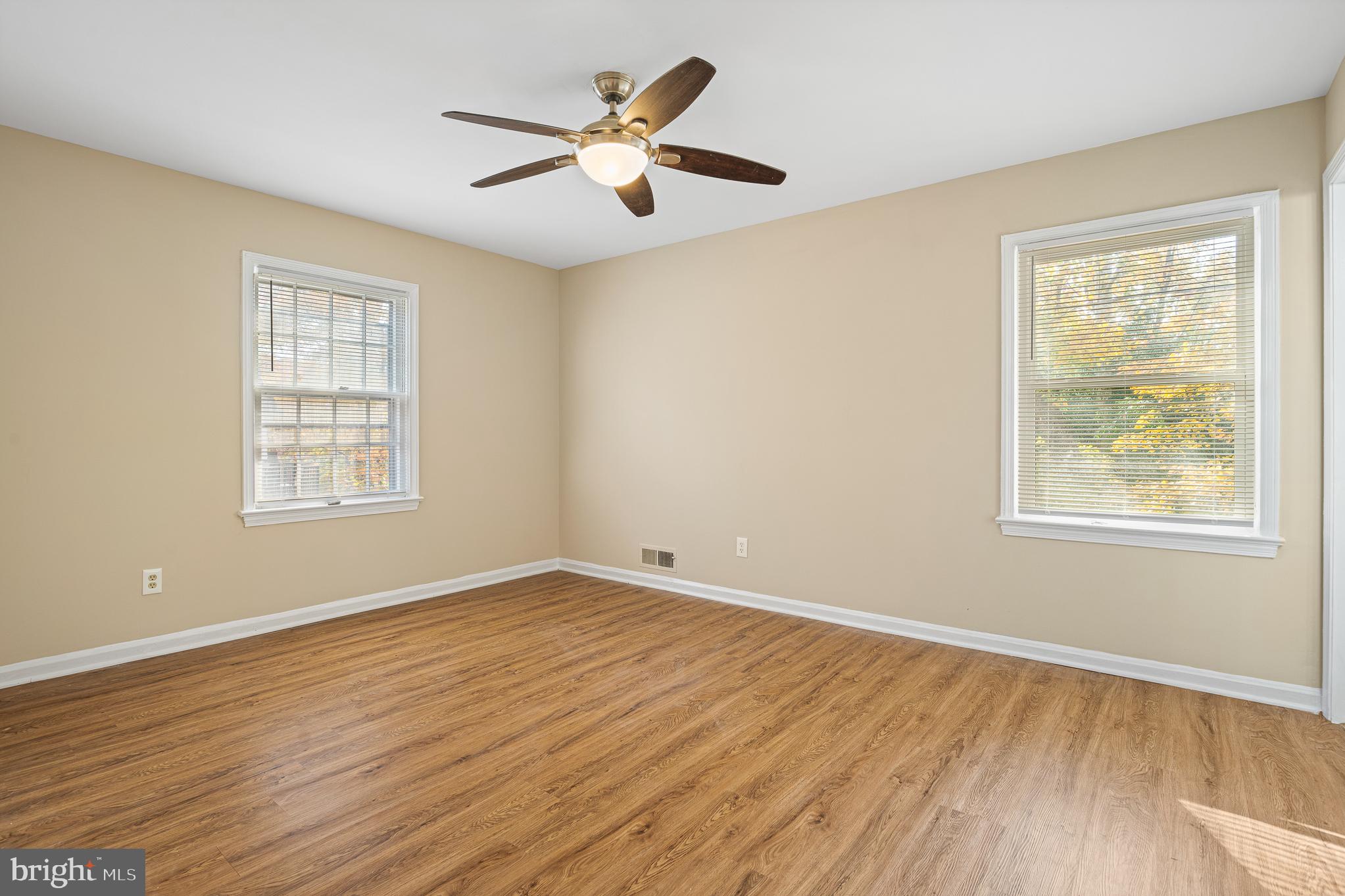 9713 Byeforde Road Kensington, MD 20895 - Photo 30 of 56 a view of an empty room with wooden floor and a window