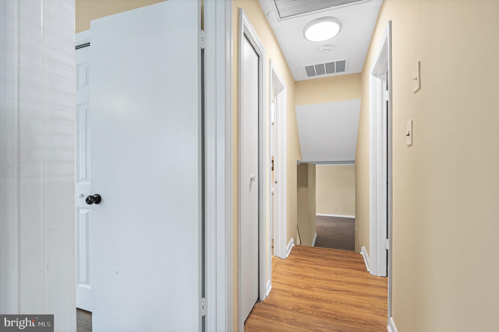 9713 Byeforde Road Kensington, MD 20895 - Photo 36 of 56 a view of a bathroom from a hallway