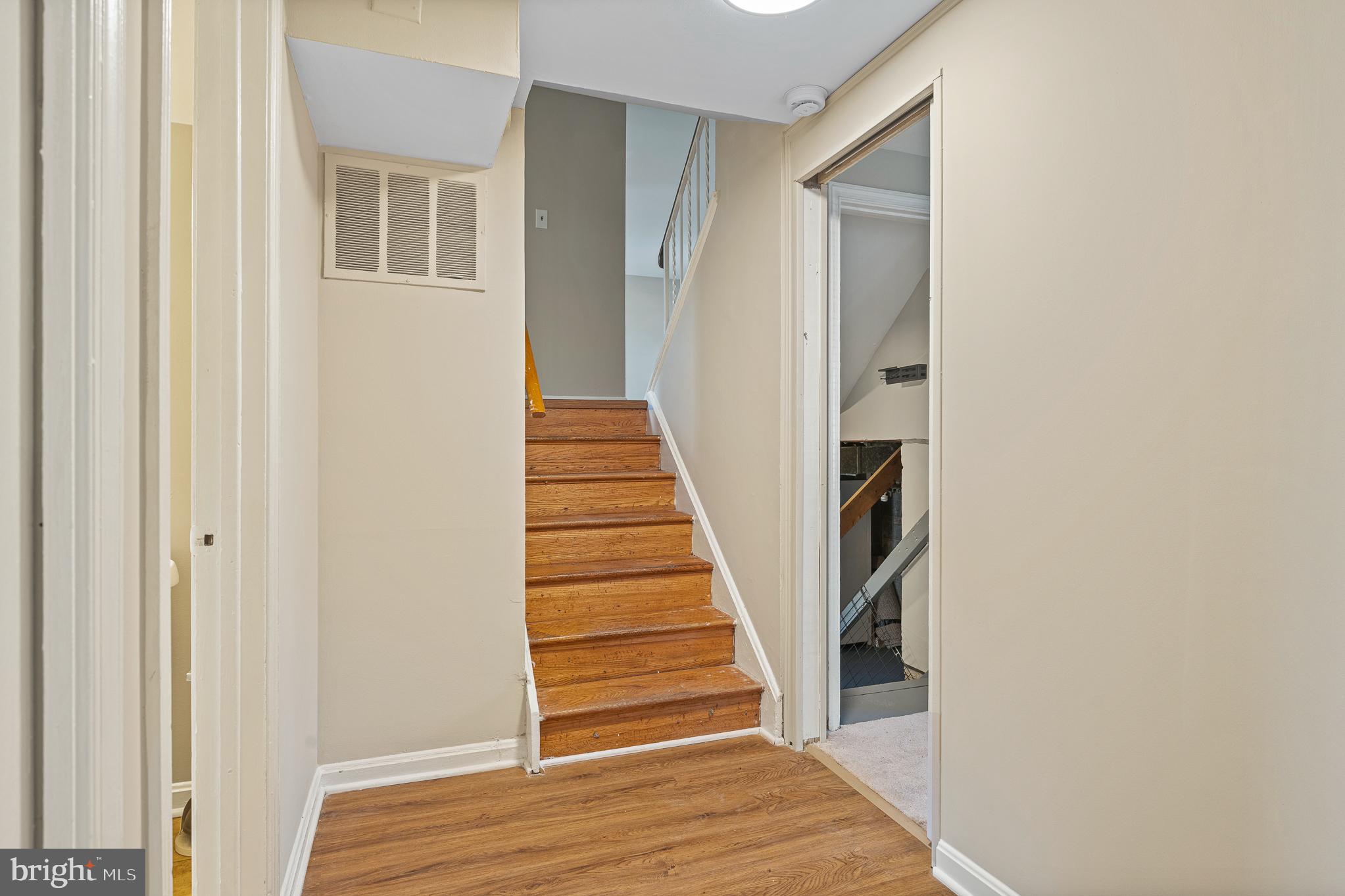 9713 Byeforde Road Kensington, MD 20895 - Photo 42 of 56 a view of a hallway with wooden floor and entryway