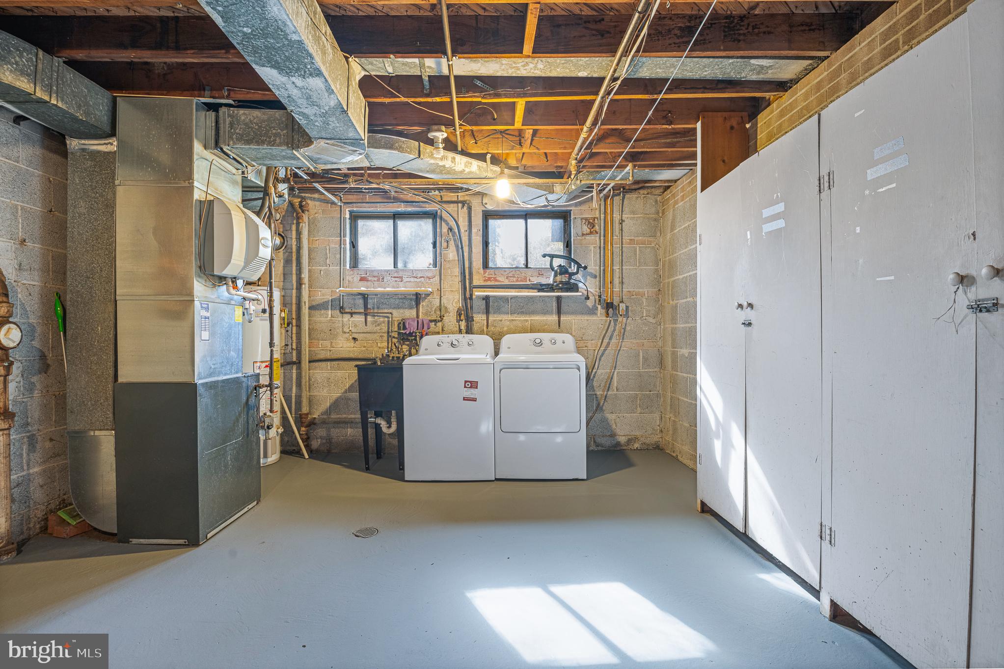 9713 Byeforde Road Kensington, MD 20895 - Photo 47 of 56 a utility room with dryer and washer
