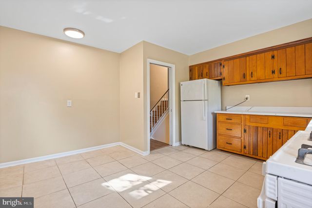 a view of a kitchen with storage and utility