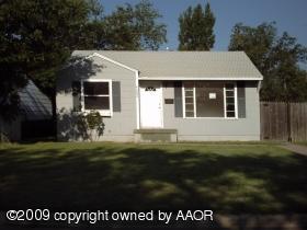 4602 South Ong Street Amarillo, TX 79110 - Photo 1 of 7 a front view of a house with a garden