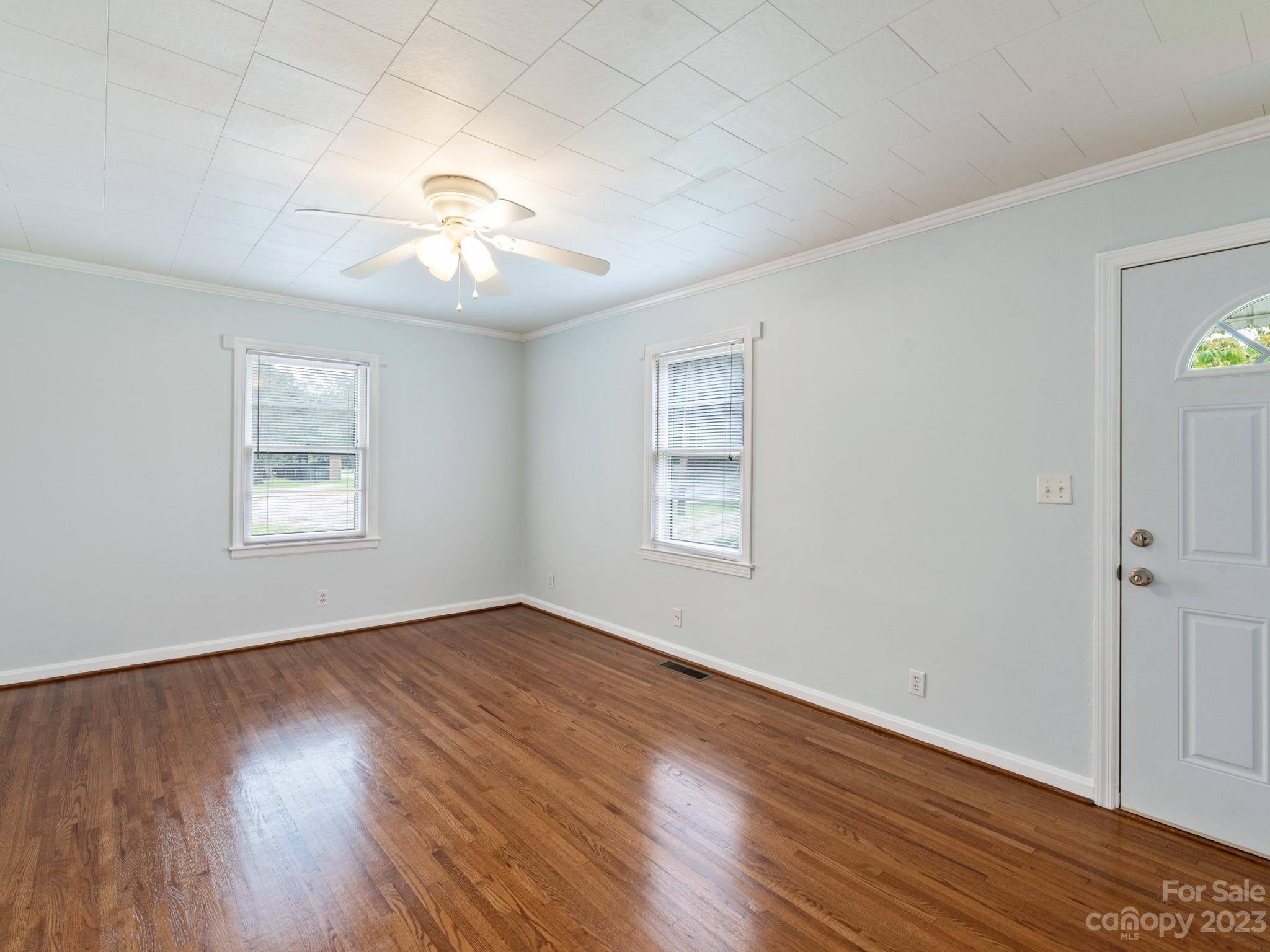 342 Union Cemetery Road Southwest Concord, NC 28027 - Photo 11 of 30 a view of an empty room with wooden floor and a window