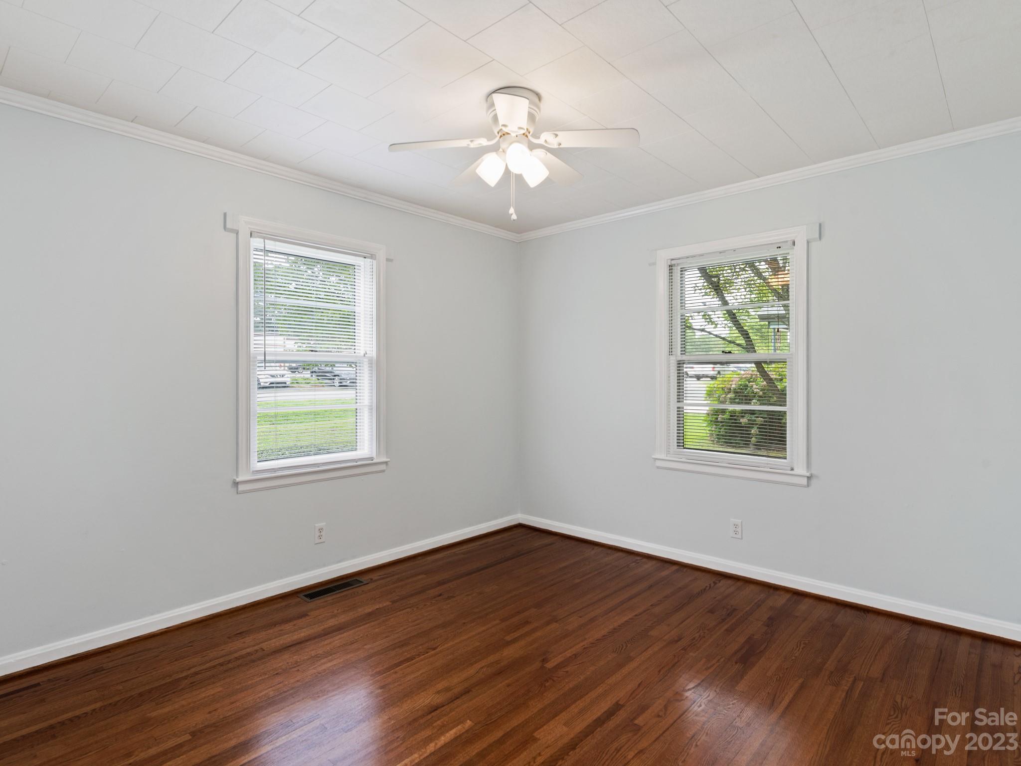 342 Union Cemetery Road Southwest Concord, NC 28027 - Photo 17 of 30 a view of an empty room with wooden floor and a window