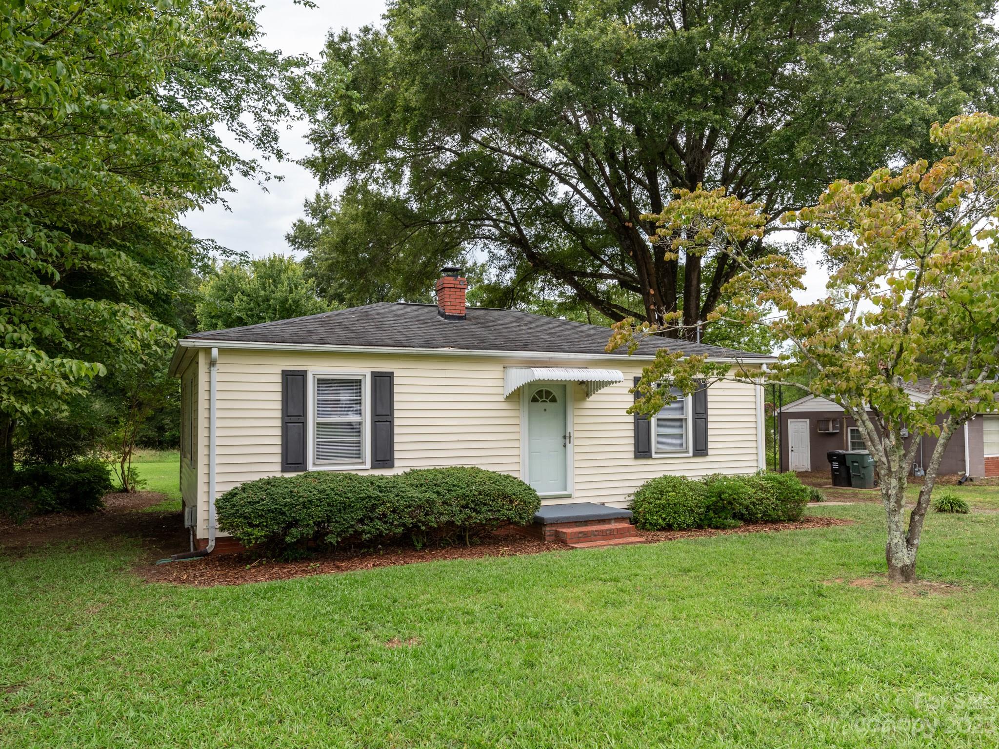 342 Union Cemetery Road Southwest Concord, NC 28027 - Photo 2 of 30 a front view of house with yard and trees
