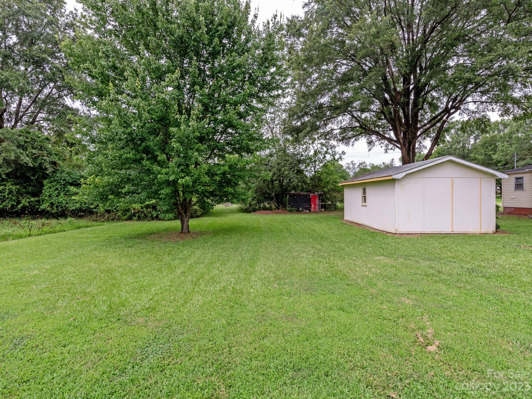 342 Union Cemetery Road Southwest Concord, NC 28027 - Photo 26 of 30 a view of a backyard with large trees