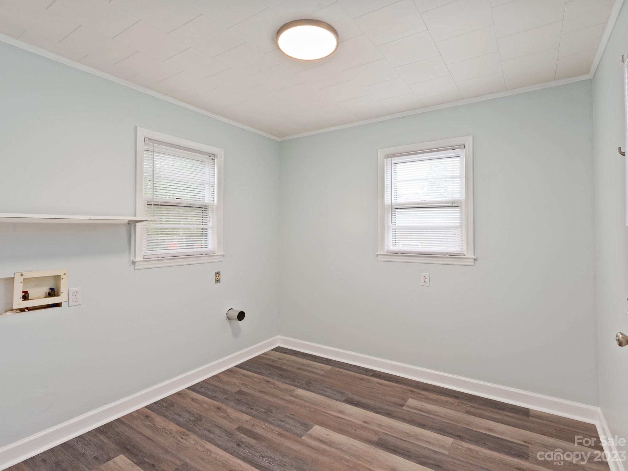 342 Union Cemetery Road Southwest Concord, NC 28027 - Photo 5 of 30 a view of room with hardwood floor and window