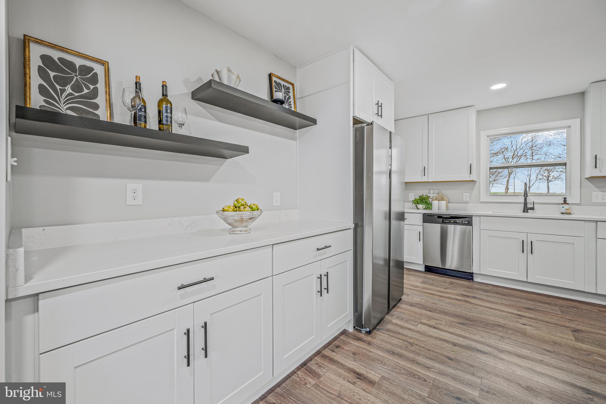 17731 Mason Dixon Road Hagerstown, MD 21740 - Photo 12 of 51 a kitchen with white cabinets and white appliances