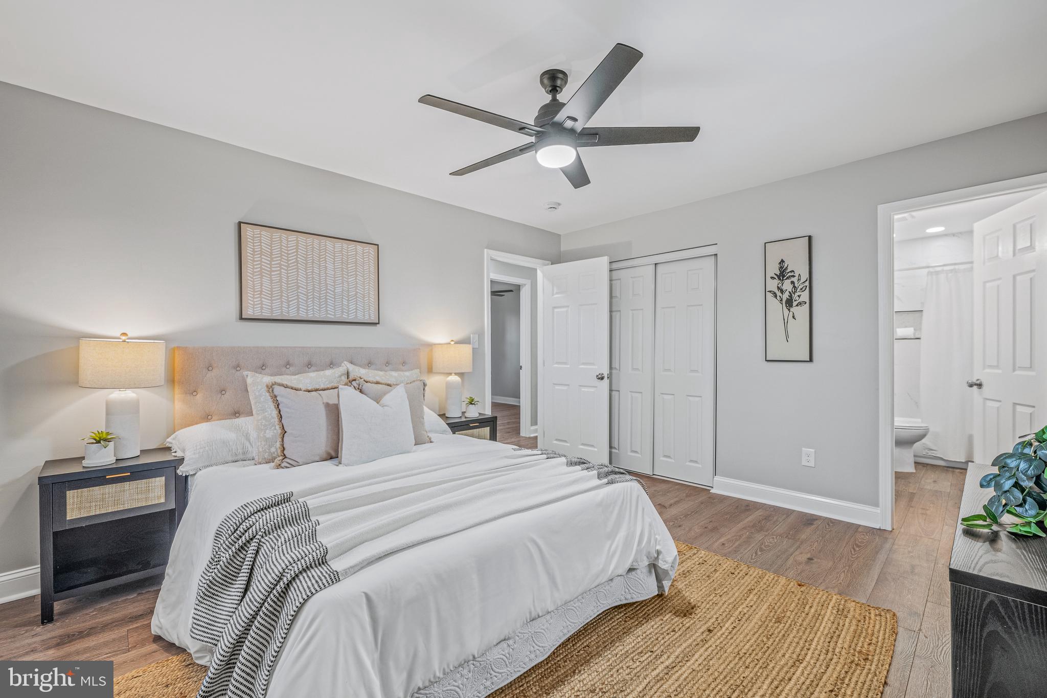 17731 Mason Dixon Road Hagerstown, MD 21740 - Photo 17 of 51 a bedroom with a large bed and a chandelier