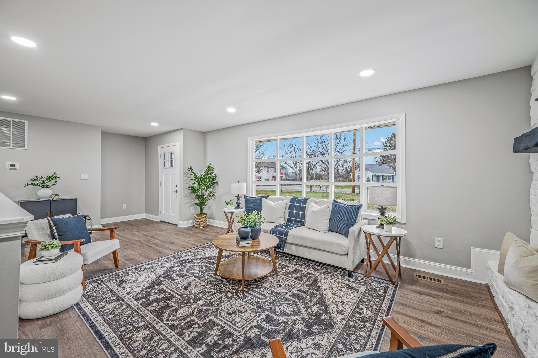 17731 Mason Dixon Road Hagerstown, MD 21740 - Photo 2 of 51 a living room with furniture and a potted plant
