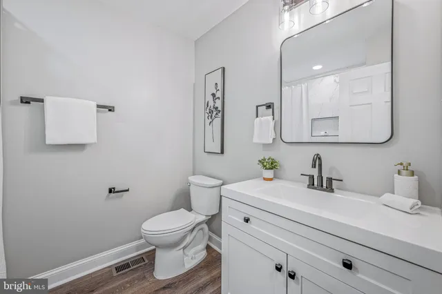 a view of room with a window and wooden floor