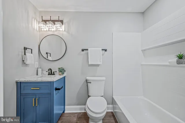 a backyard of a house with yard fire pit and outdoor seating