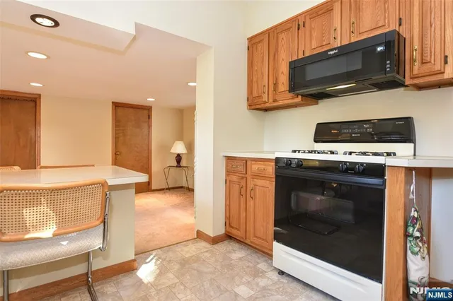 a kitchen with a stove and a microwave