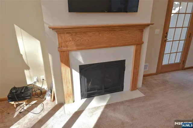 a view of a livingroom with furniture and a fireplace