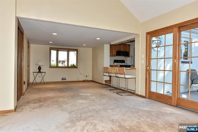 a view of a livingroom with furniture and a window