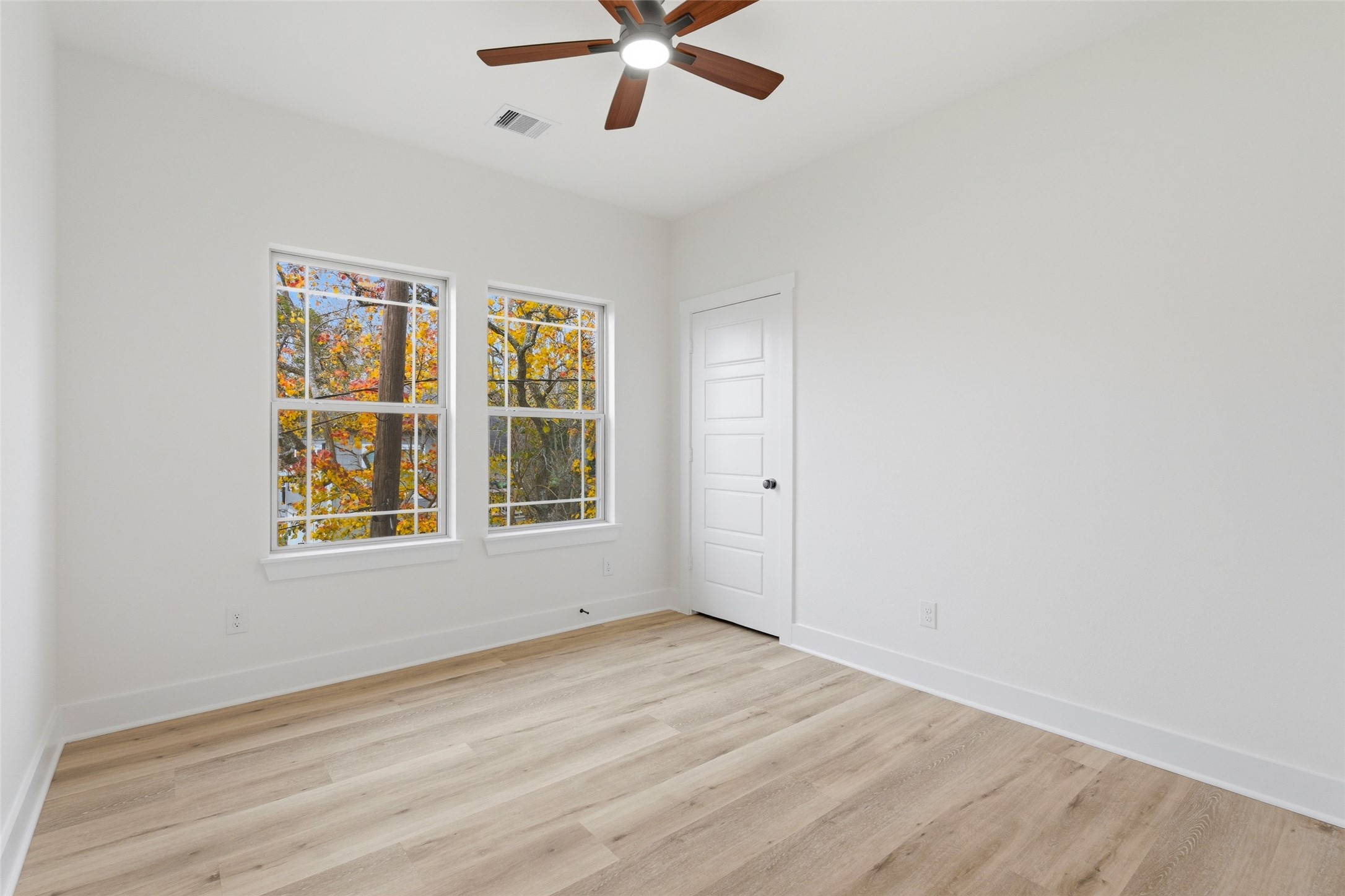 317 South 3rd Street La Porte, TX 77571 - Photo 13 of 15 wooden floor in an empty room with a window