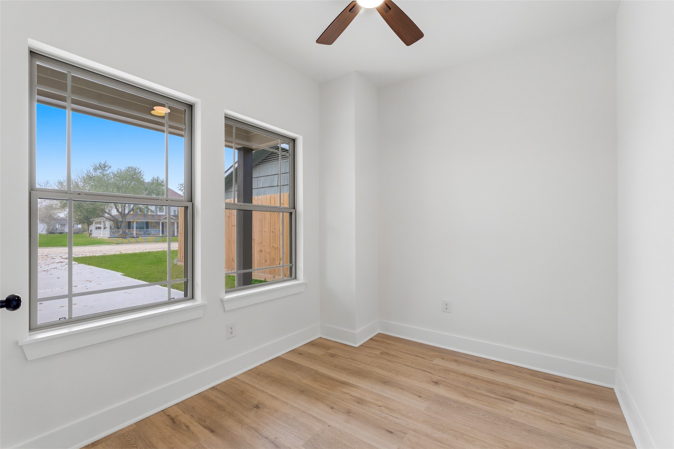 317 South 3rd Street La Porte, TX 77571 - Photo 2 of 15 an empty room with a window and a ceiling fan
