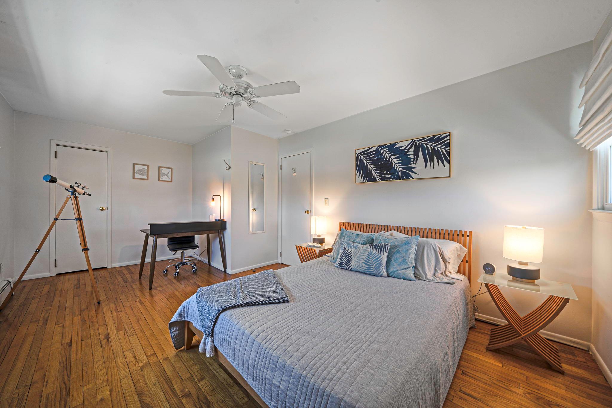 3 Crestview Drive Remsenburg, NY 11960 - Photo 8 of 21 Bedroom with a ceiling fan, baseboards, and wood-type flooring