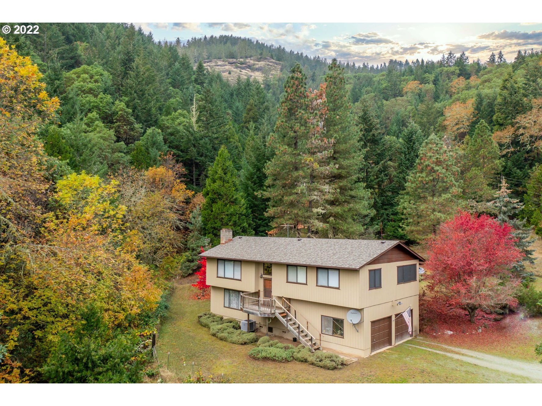 2026 Spring Brook Road Myrtle Creek, OR 97457 - Photo 1 of 32 a view of a house with a yard