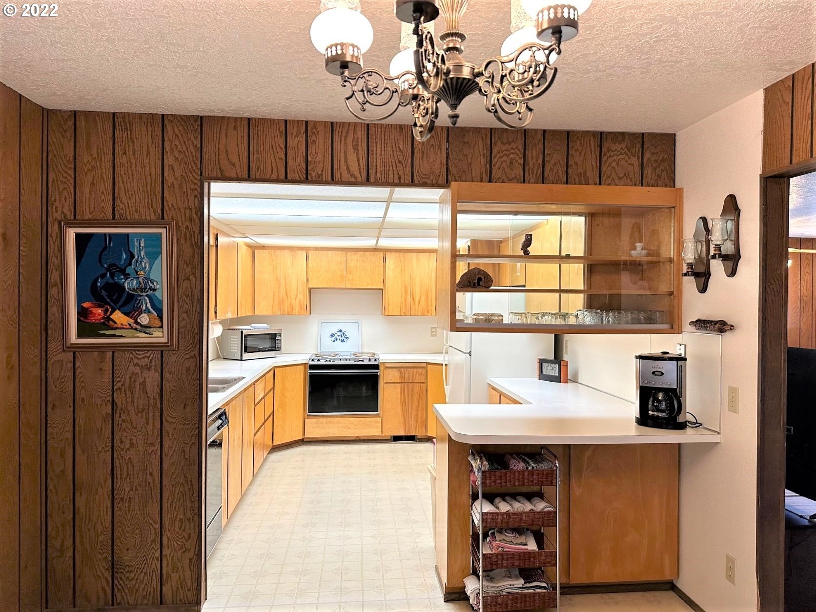 2026 Spring Brook Road Myrtle Creek, OR 97457 - Photo 14 of 32 a kitchen with stainless steel appliances a stove a sink and a refrigerator