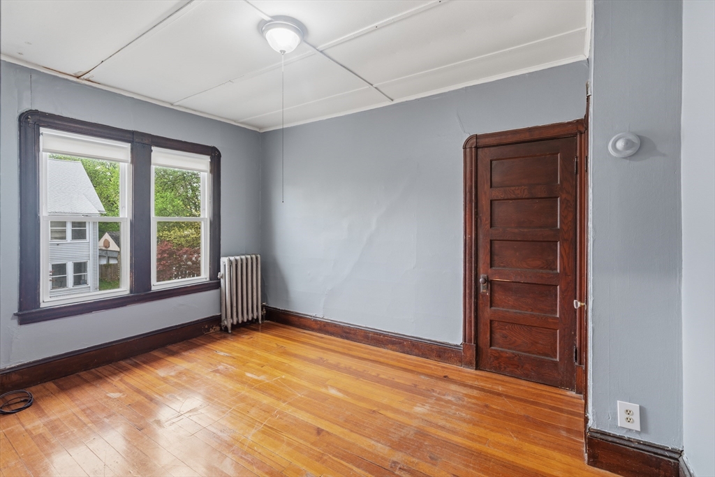 43 Elmdale Street, Unit 2 West Springfield, MA 01089 - Photo 8 of 14 a view of an empty room with a window
