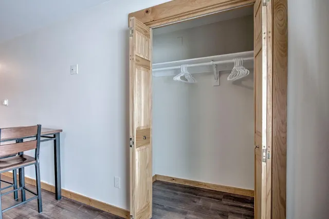 a view of room with wooden floor