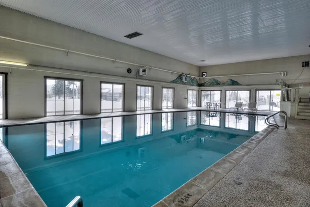 a view of swimming pool from a balcony