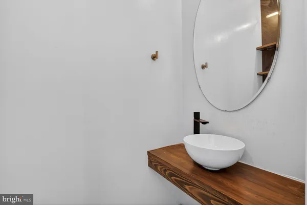 a bathroom with a sink and mirror