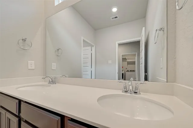 a white bath tub sitting next to a white toilet