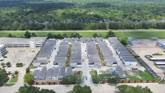 an aerial view of a house with swimming pool