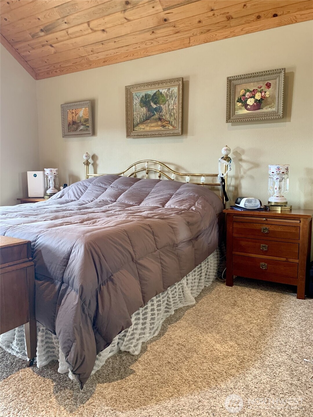 35 Low Ridge Road Malo, WA 99150 - Photo 12 of 38 a bedroom with a bed dresser and painting on the wall
