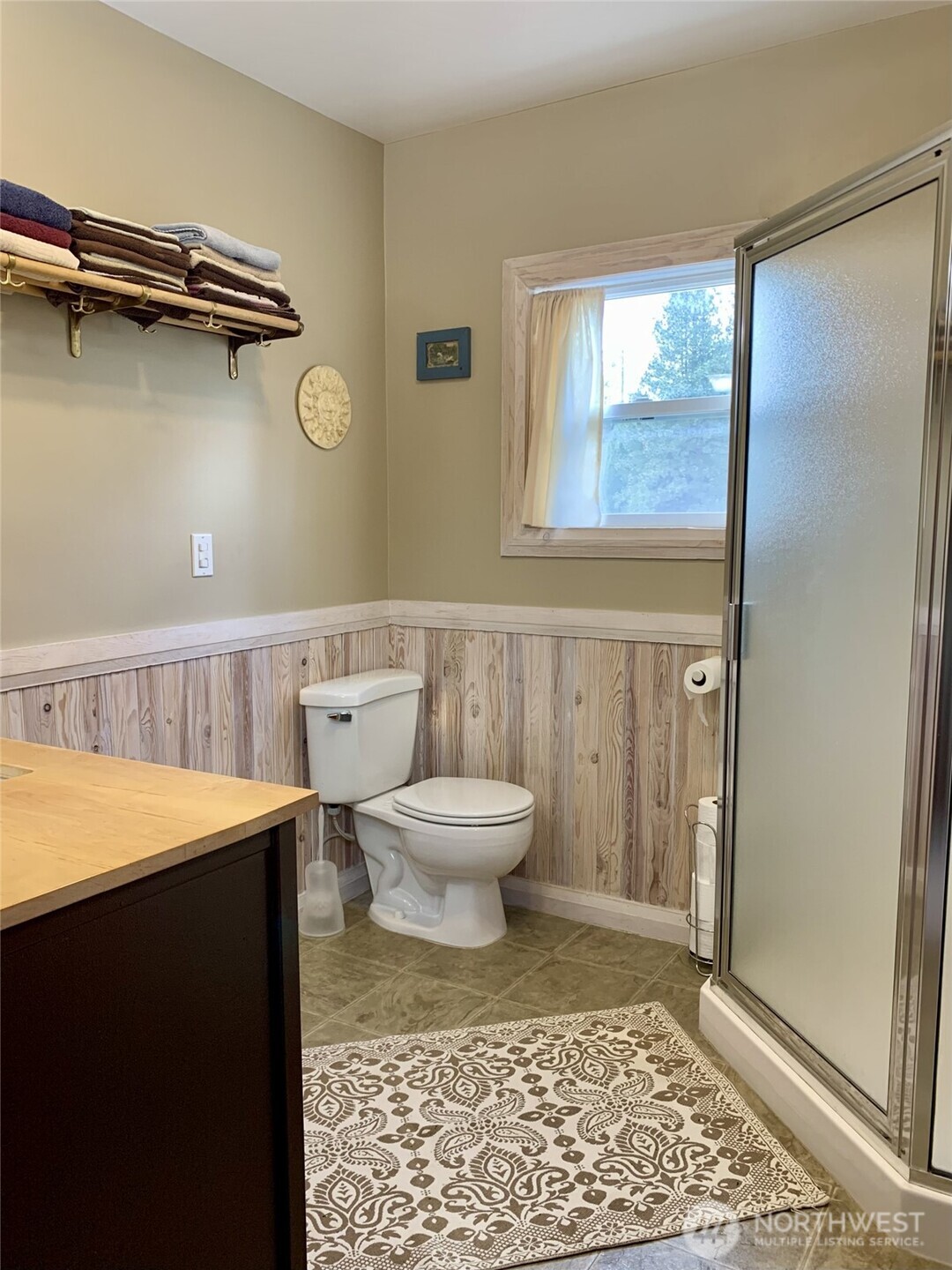 35 Low Ridge Road Malo, WA 99150 - Photo 14 of 40 a bathroom with a toilet a sink and a mirror