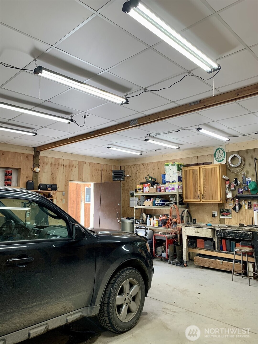 35 Low Ridge Road Malo, WA 99150 - Photo 39 of 40 a car and car parked in a garage